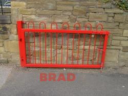 Bespoke small red gate manufactured in mild steel, galvanised and powder coated, for a school by Bradfabs 