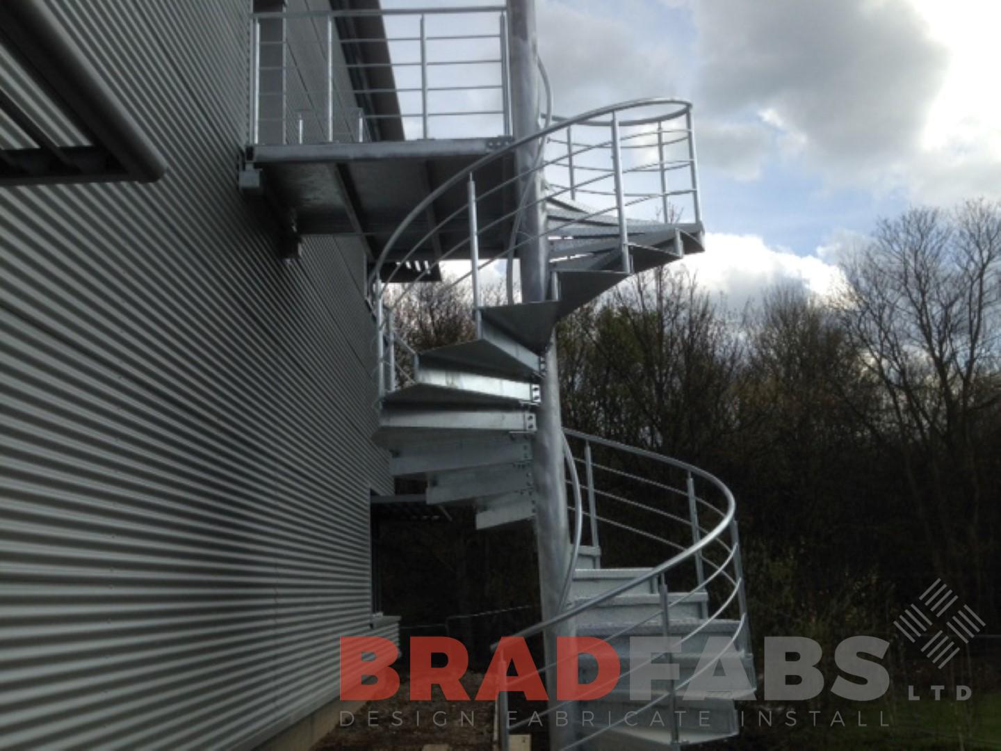 Commercial external fire access route metal spiral stairs