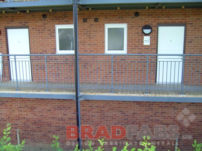 Bradfabs made this balcony access structure, made using mild steel, with timber decking installed on some apartments in Leeds, West Yorkshire