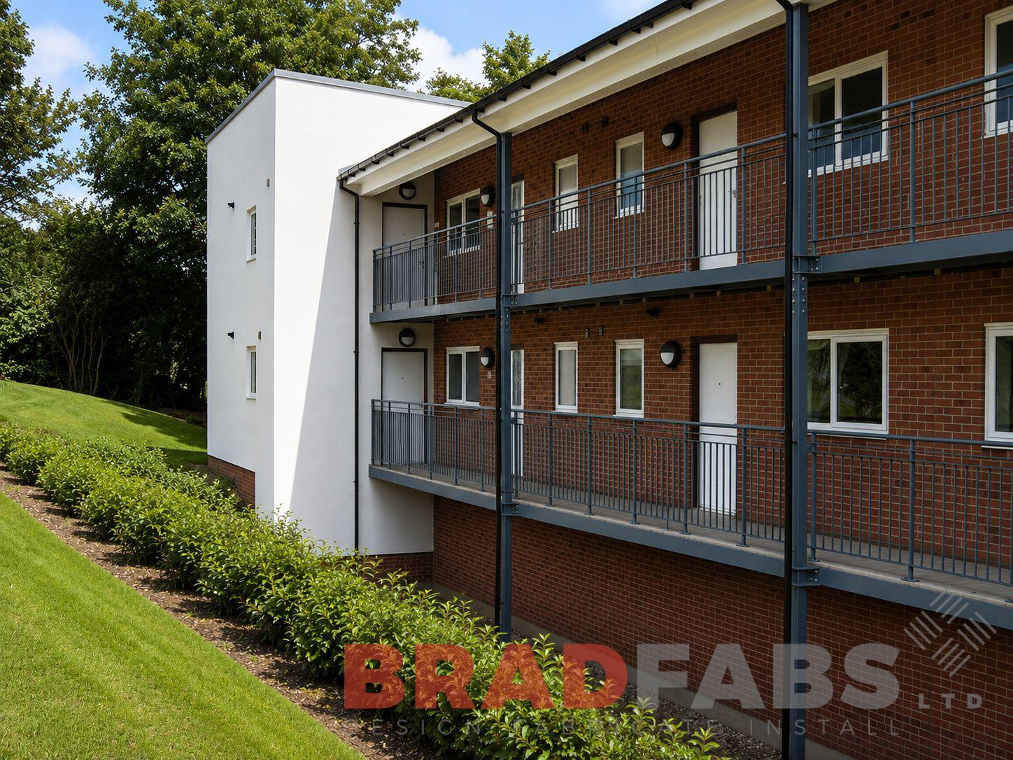 Bradfabs made this balcony access structure, made using mild steel, with timber decking installed on some apartments in Leeds, West Yorkshire