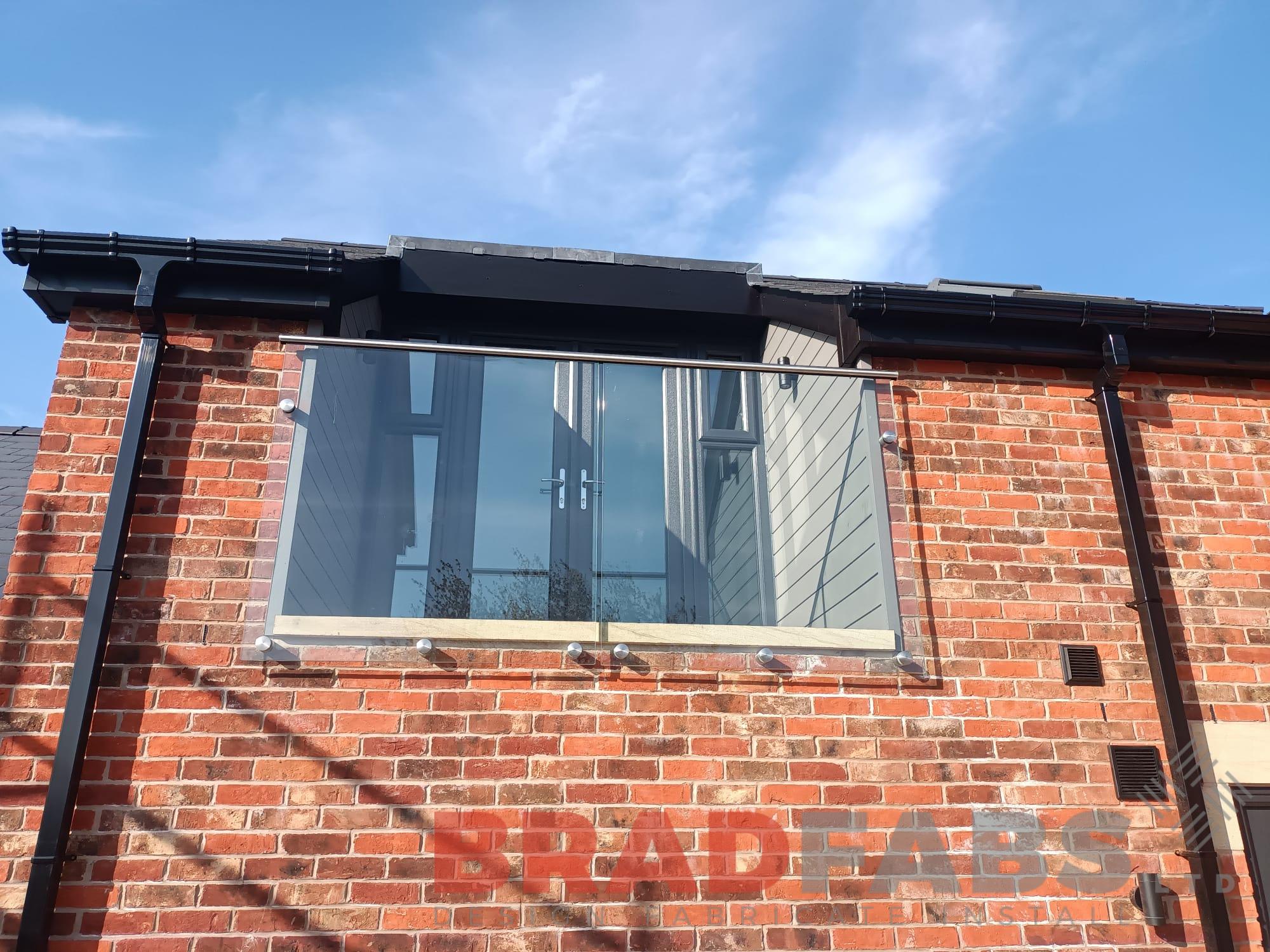 Glass balconette over doors by Bradfabs