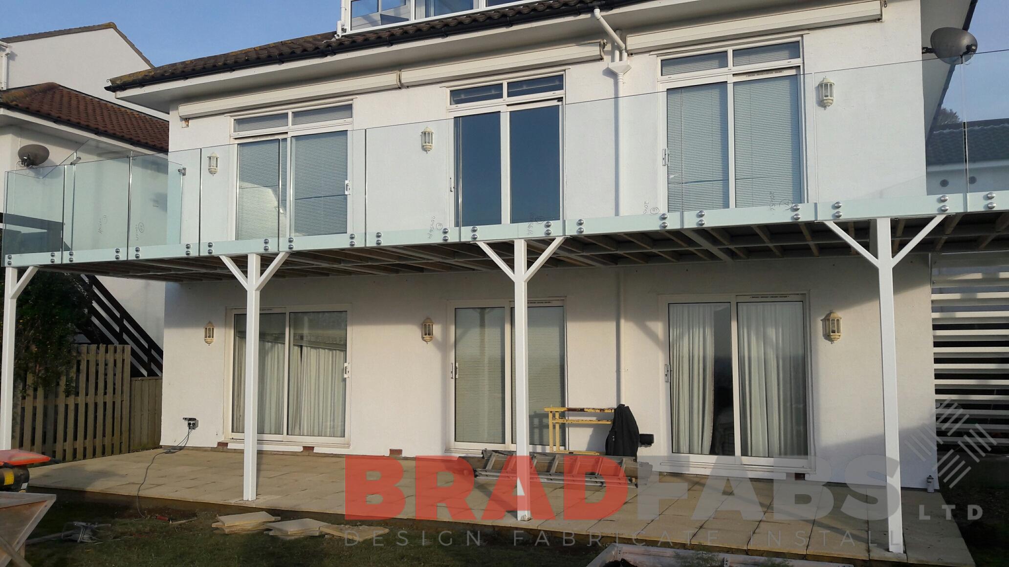 Large floating glass balcony with single flight staircase