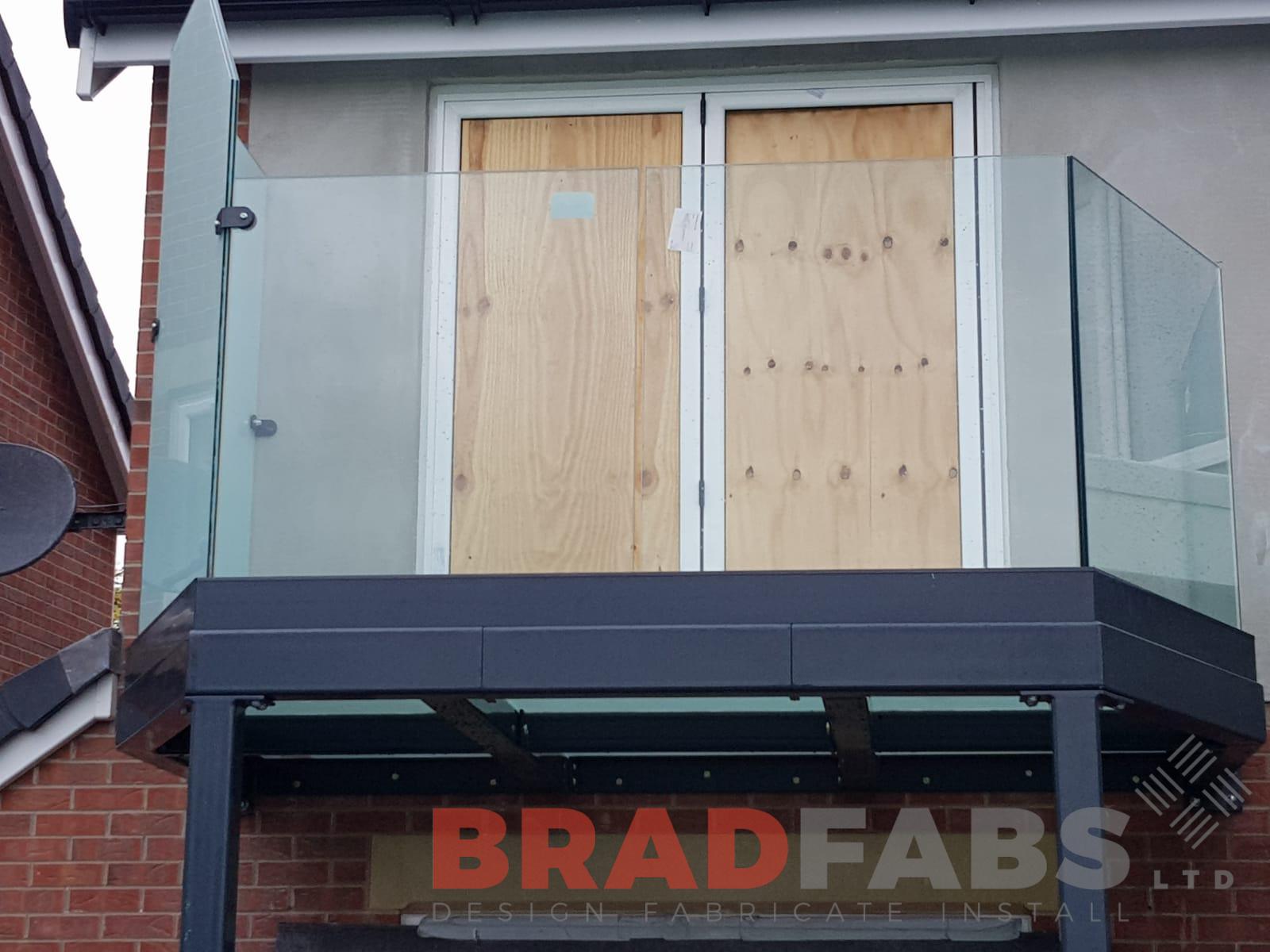 Mild steel galvanised and powder coated balcony with infinity glass channel system balustrade by Bradfabs 