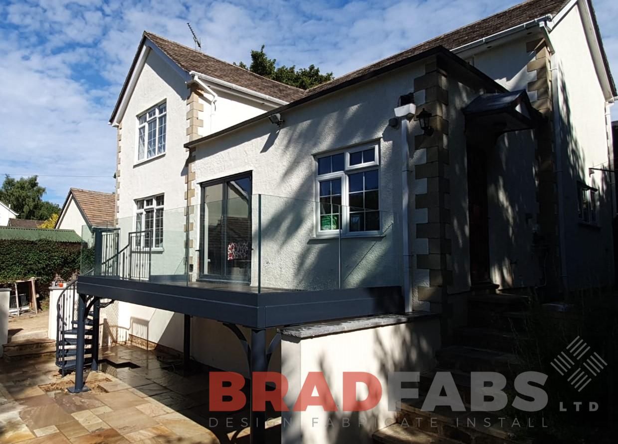 Large balcony and staircase with channel system infinty glass by Bradfabs Ltd