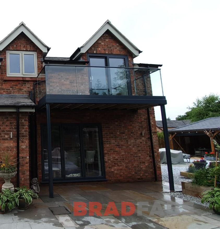 Balcony, mild steel, galvanised and powder coated, glass balustrade with powder coated top rail by Bradfabs 