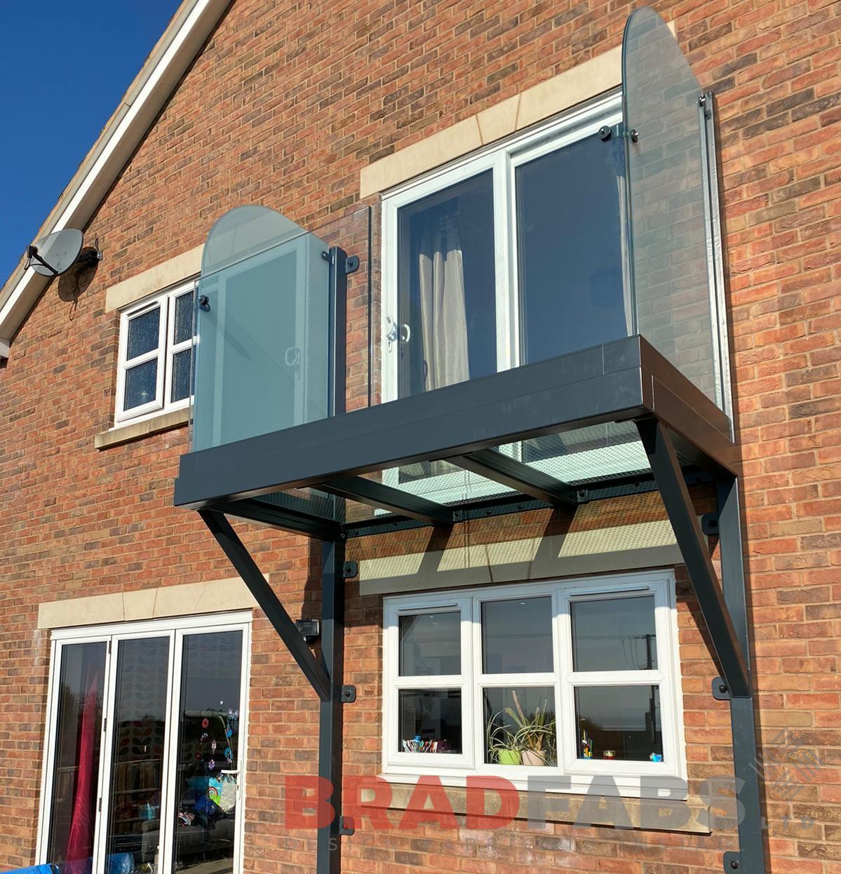 balcony with glass floor and privacy screen to either side by Bradfabs Ltd 