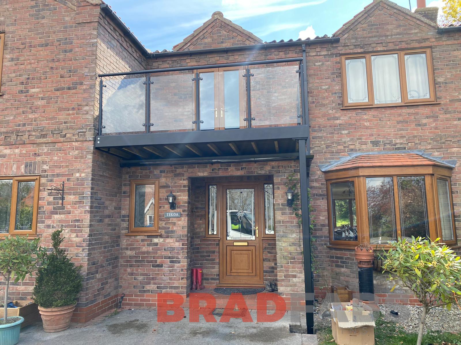 Bradfabs, bespoke balcony, mild steel and glass balustrade, composite decked flooring 