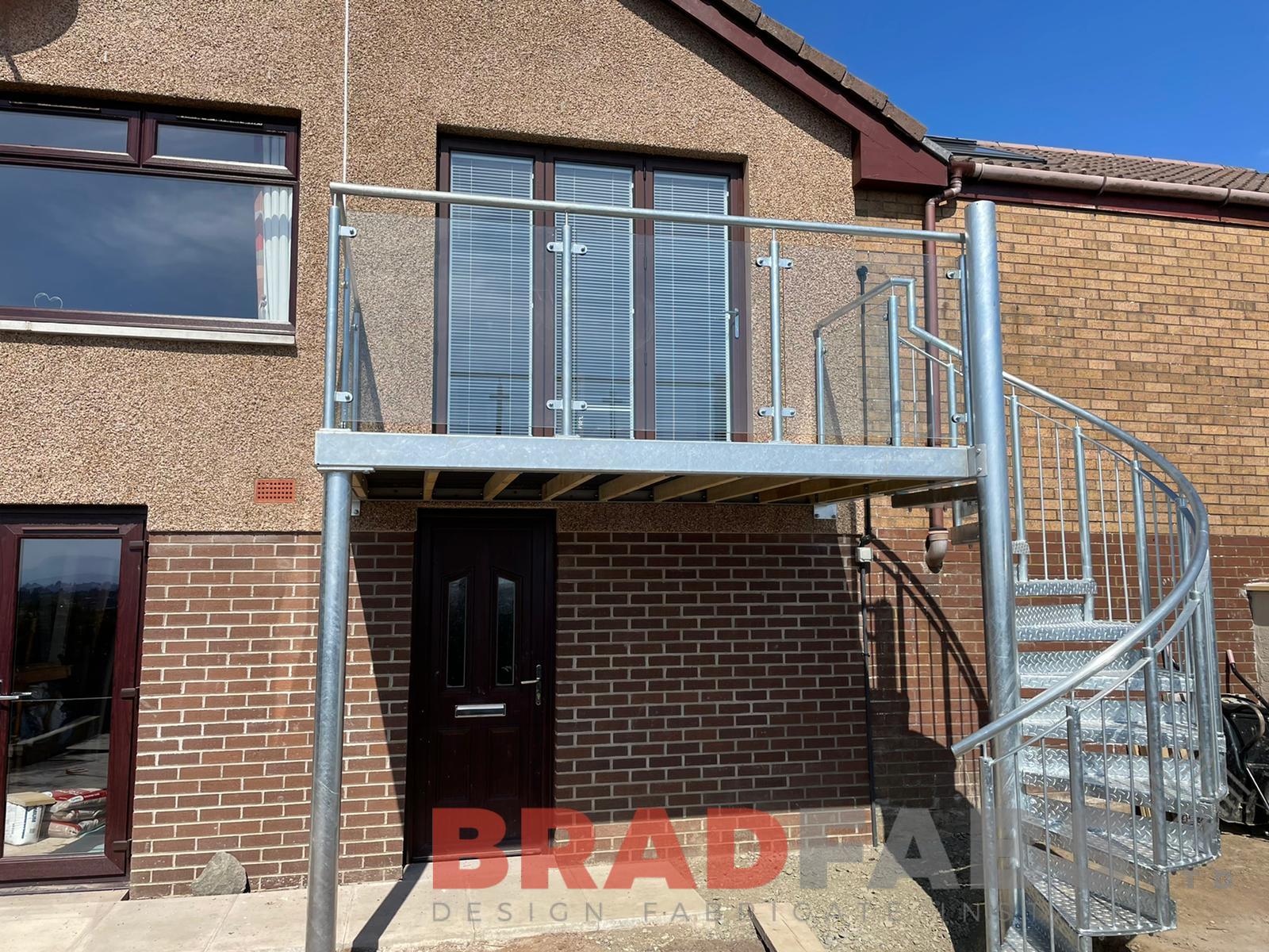 Bradfabs, bespoke balcony, steel balcony, galvanised balcony, spiral staircase, durbar treads, glass balustrade 