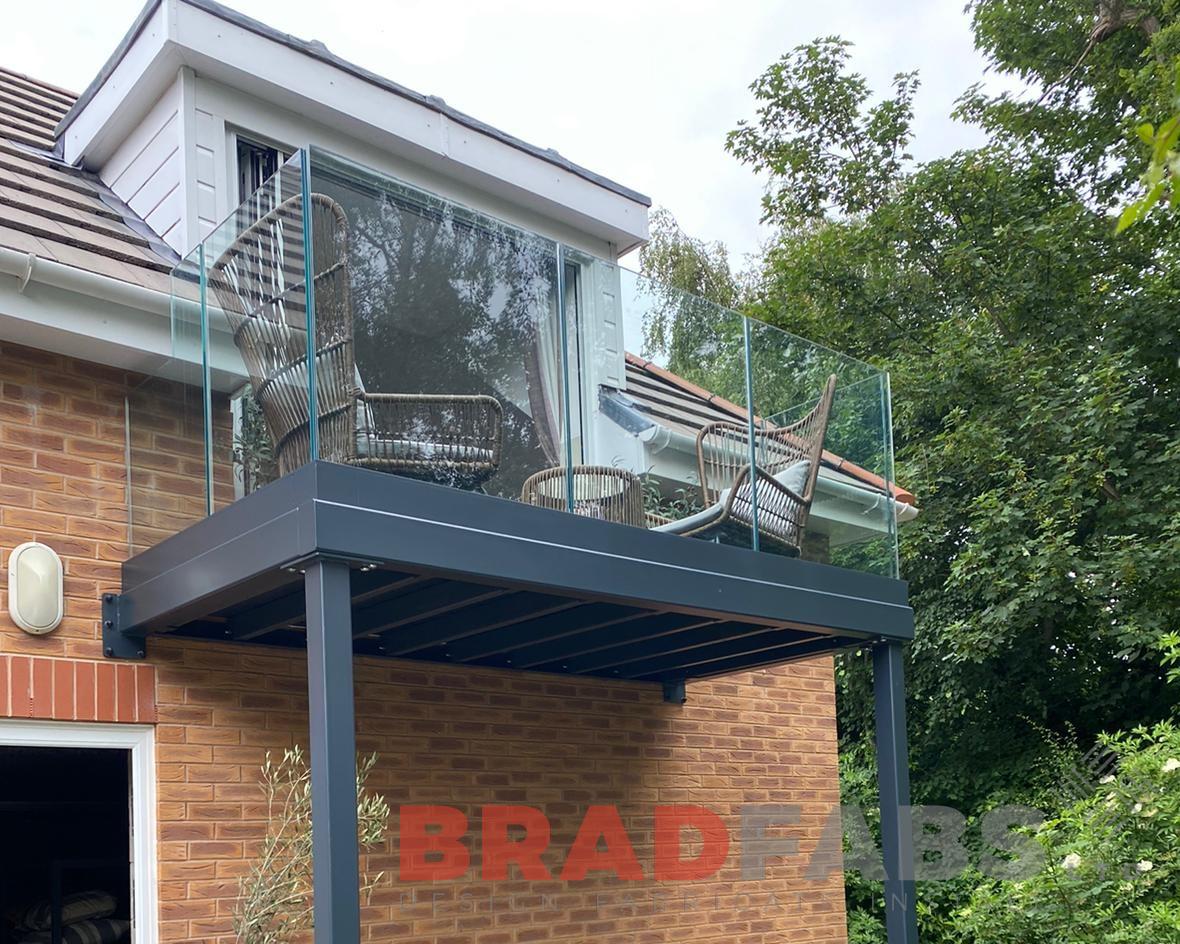 Bradfabs, balcony, bespoke balcony, channel system balustrade, infinity glass balustrade, composite decked flooring, steel balcony, metal balcony, 