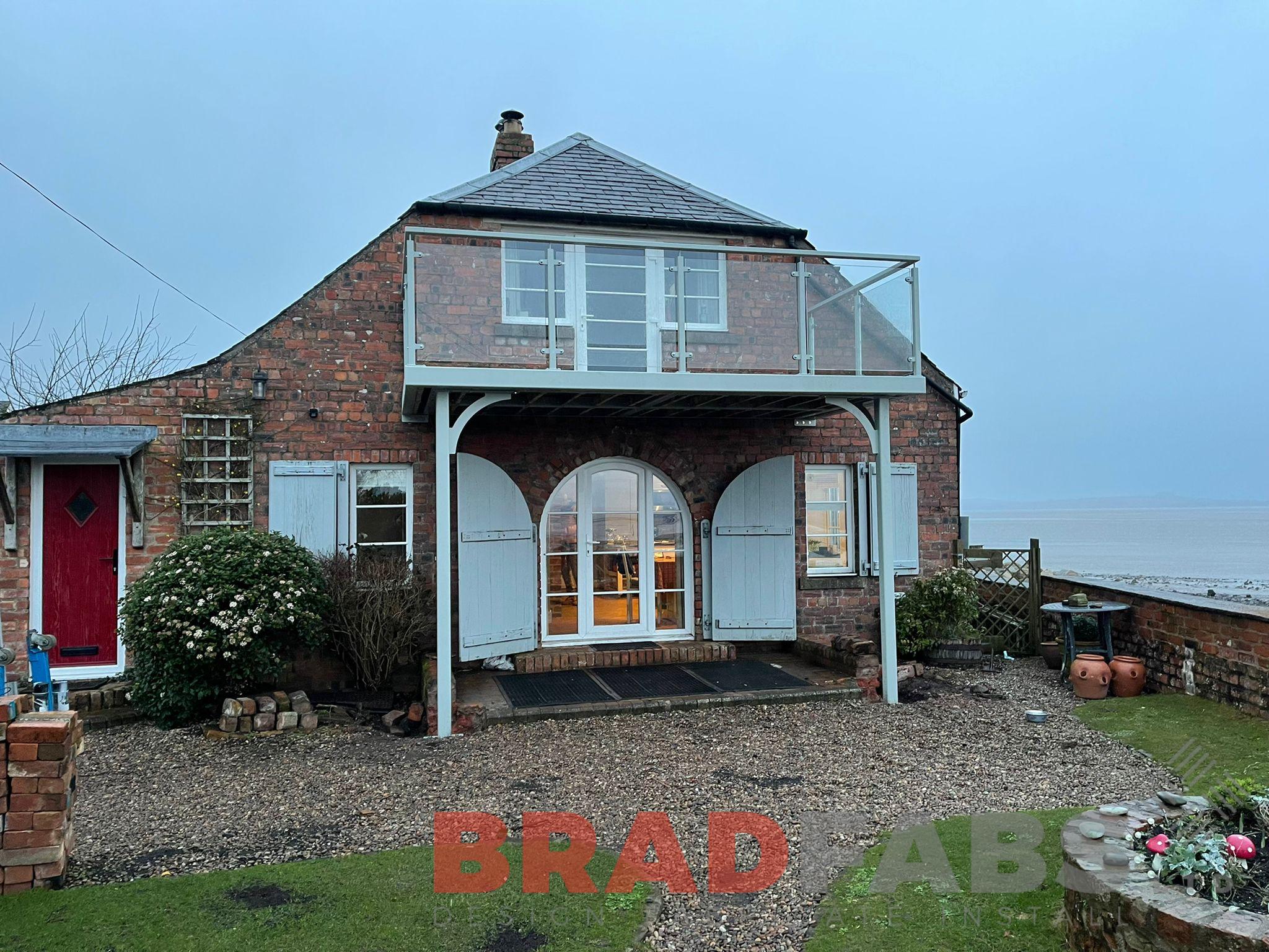 Bradfabs, balcony, bespoke steel balcony, balcony seafront, steelwork, balcony with legs 