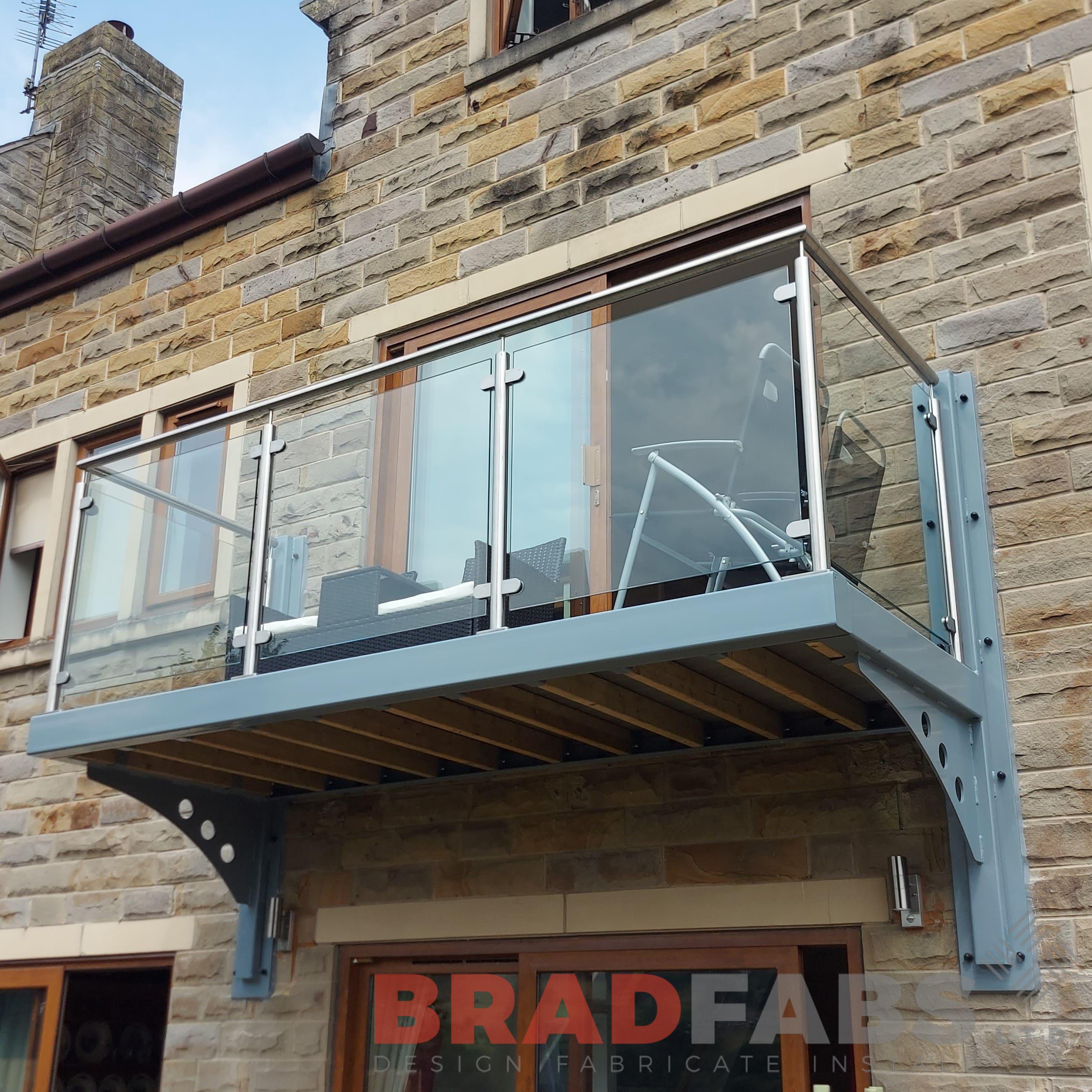 Bespoke cantilevered balcony with stainless steel and glass balustrade by bradfabs ltd 