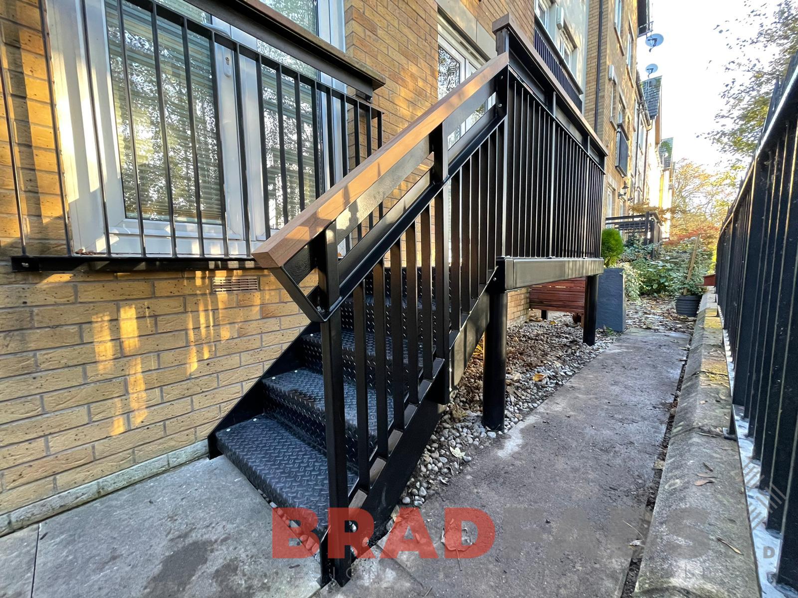 Balcony with small staircase, oak top rail bespoke by bradfabs 