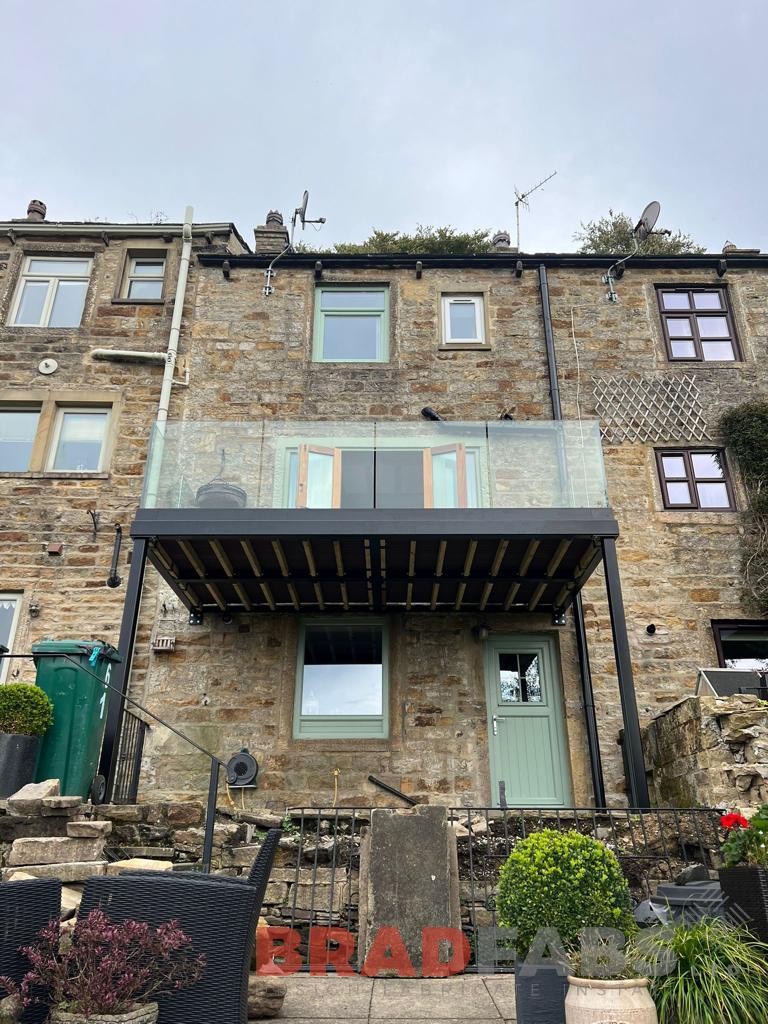 Balcony with frameless glass balustrade for a domestic property by bradfabs