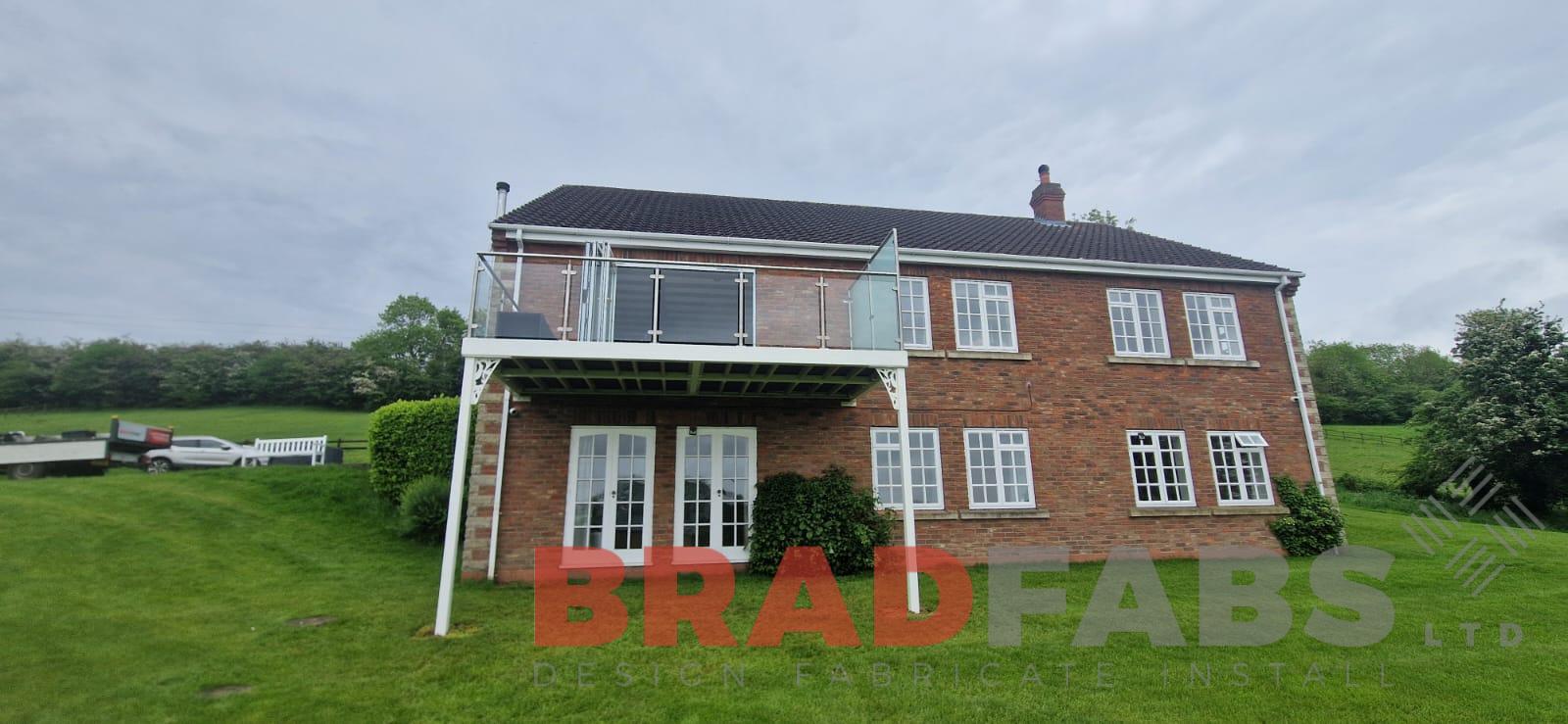 Balcony, stainless steel and glass balustrade, composite decking 