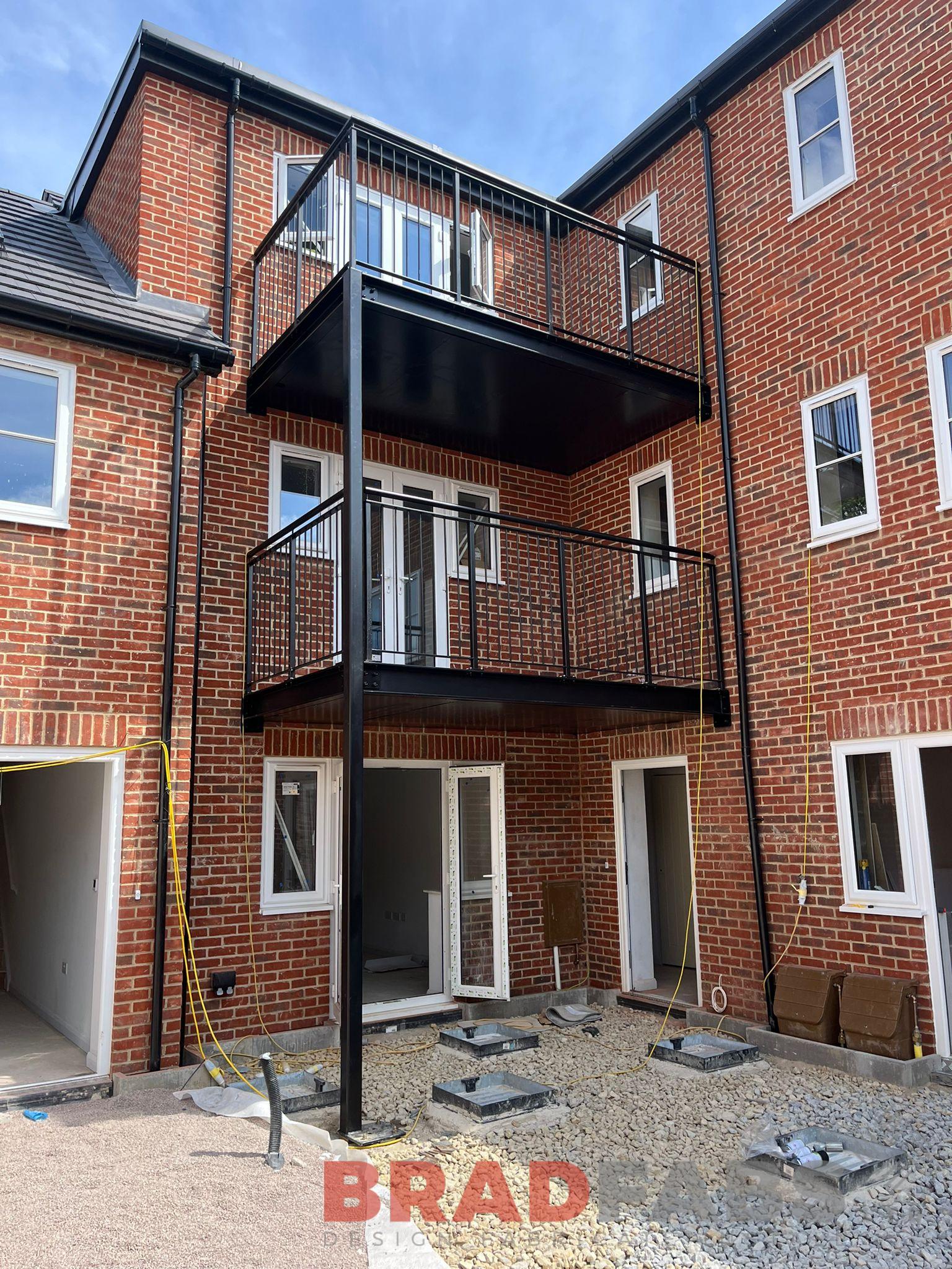 Double stacked balconies, bradfabs balconies powder coated black, vertical bar balustrade 