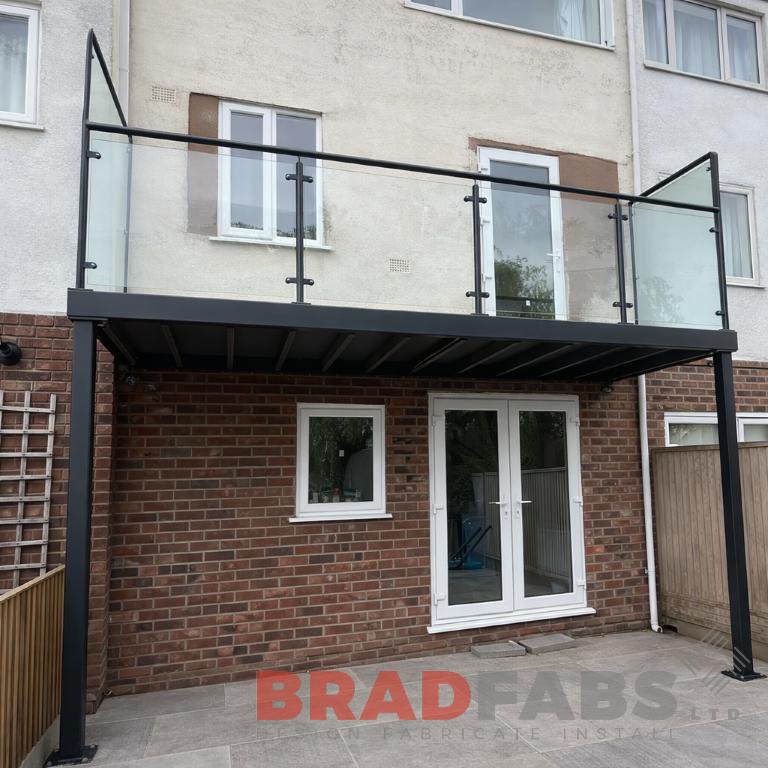 Balcony with glass infill panels, composite decked flooring, privacy screen balcony 