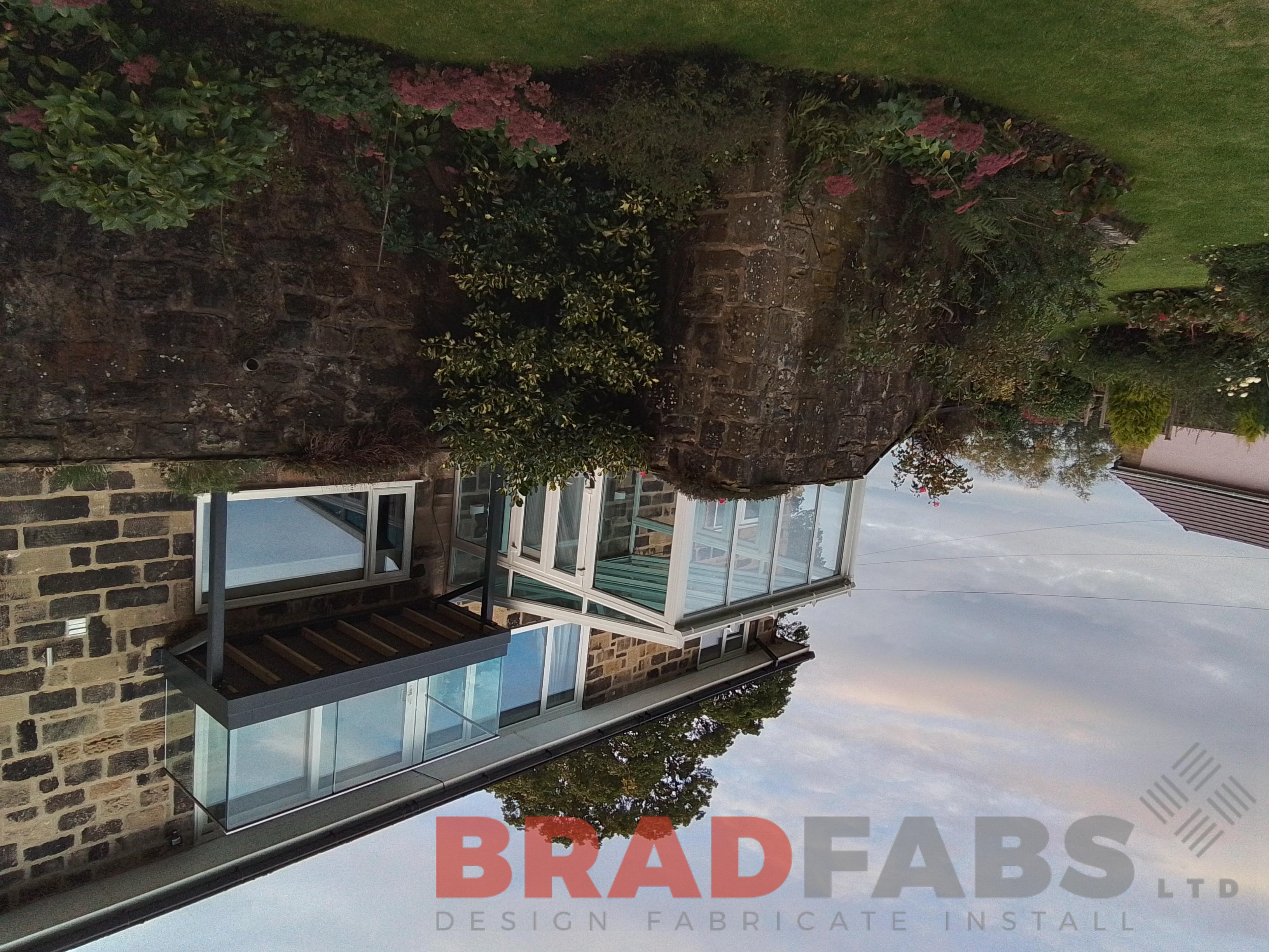 Replacement balcony with composite decking by Bradfabs