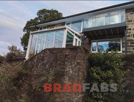 Replacement balcony with composite decking by Bradfabs