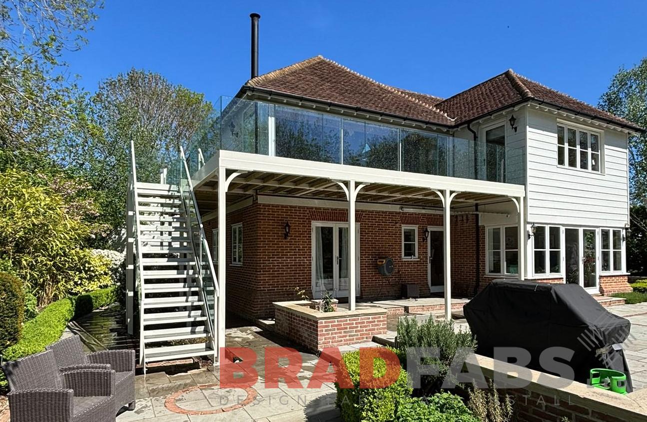 Balcony and  external stairs in white installed in Meldreth