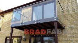 Balcony with two support legs and font fixed glass balustrade by bradfabs 