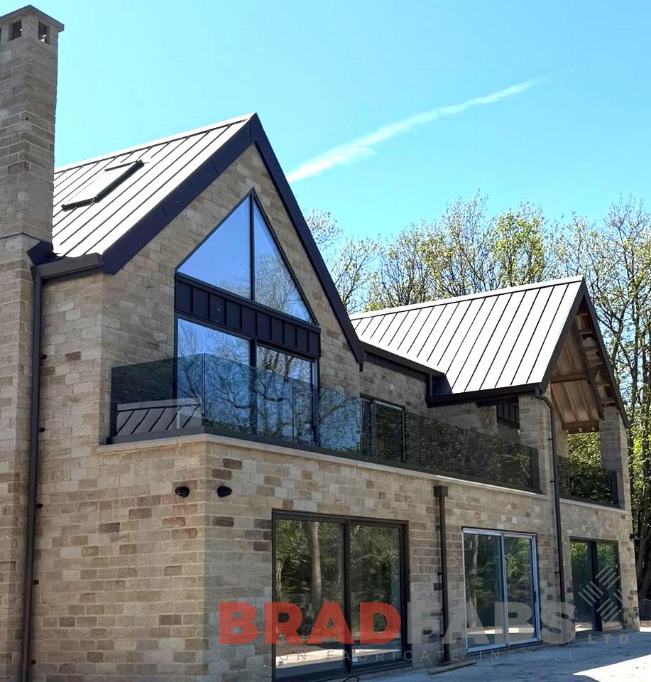Supply and installation of a channel system infinity tinted glass balustrade 28.8m in Leeds