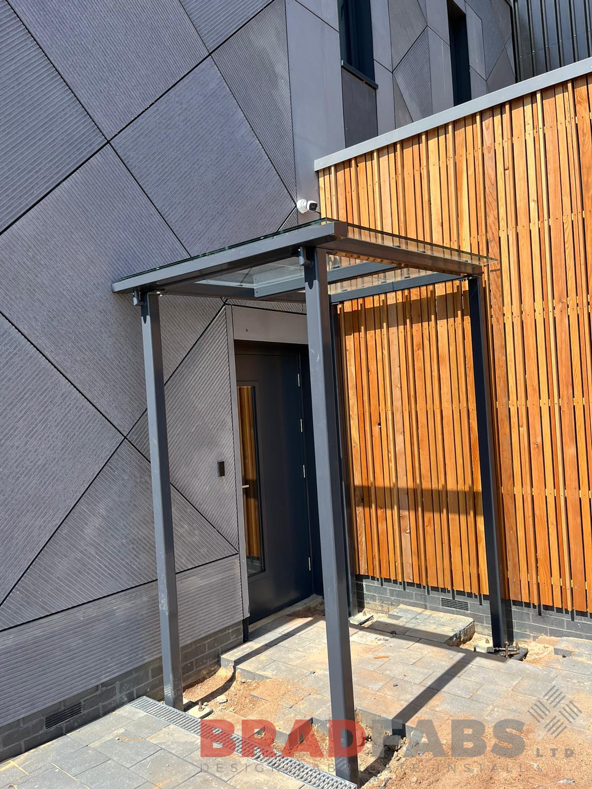 Curved steel canopy with glass panels by bradfabs