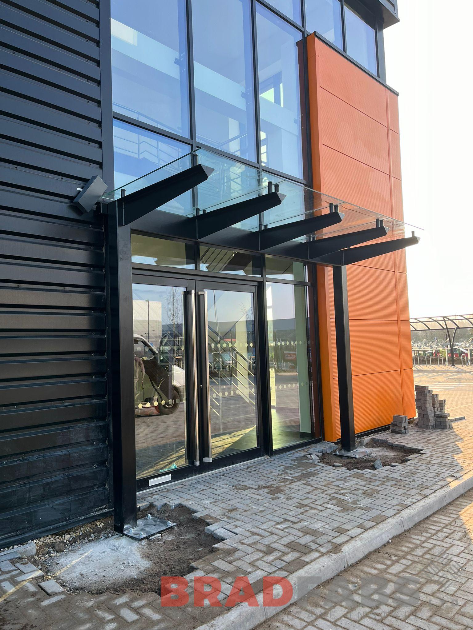 Steel and glass canopy for a commercial property by bradfabs