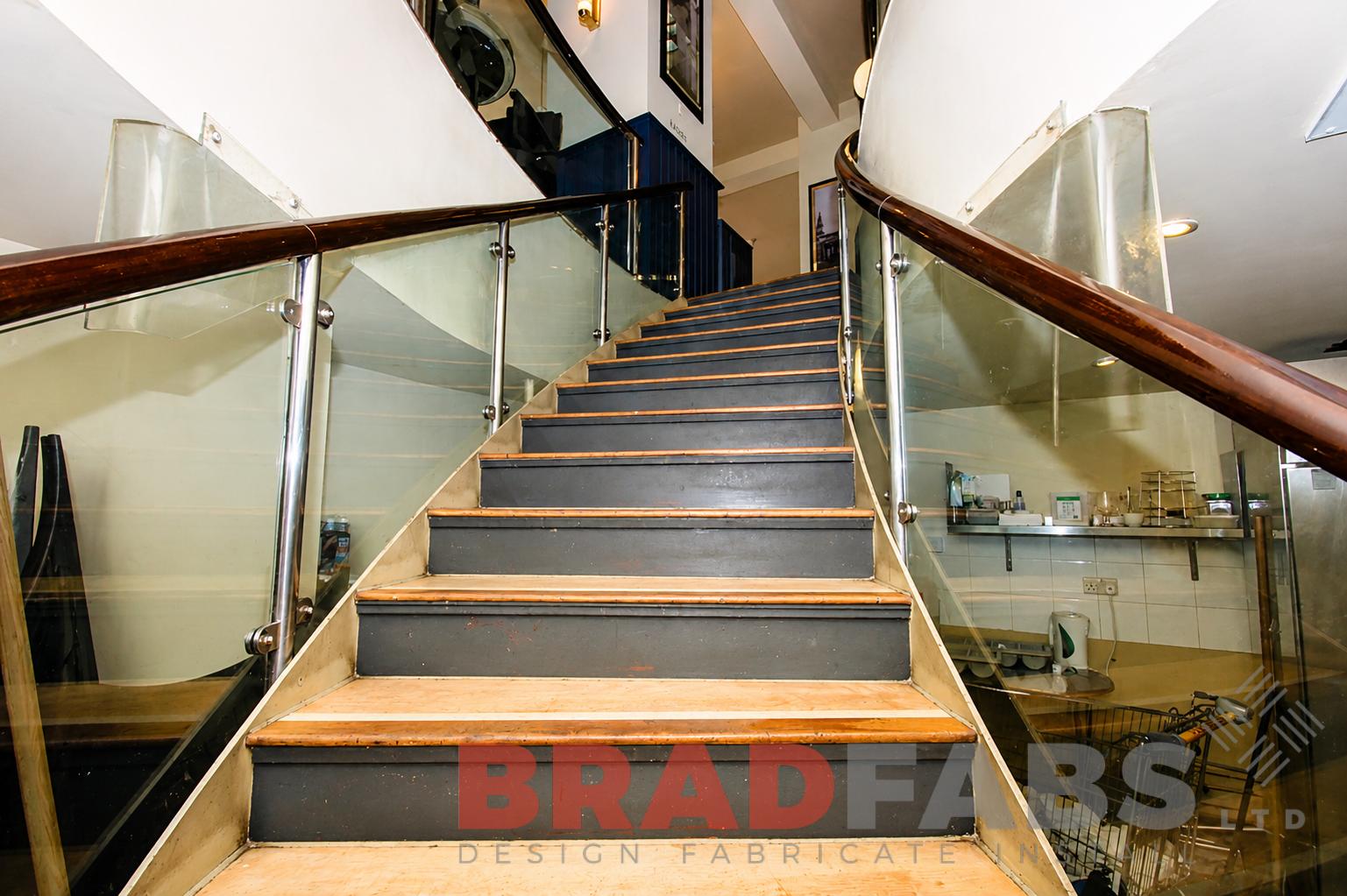 Helix Staircase with Timber Handrail and Glass Panels In Leeds