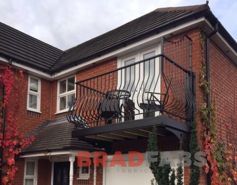 Powder coated mild steel belly and nose  balustrade to the balcony