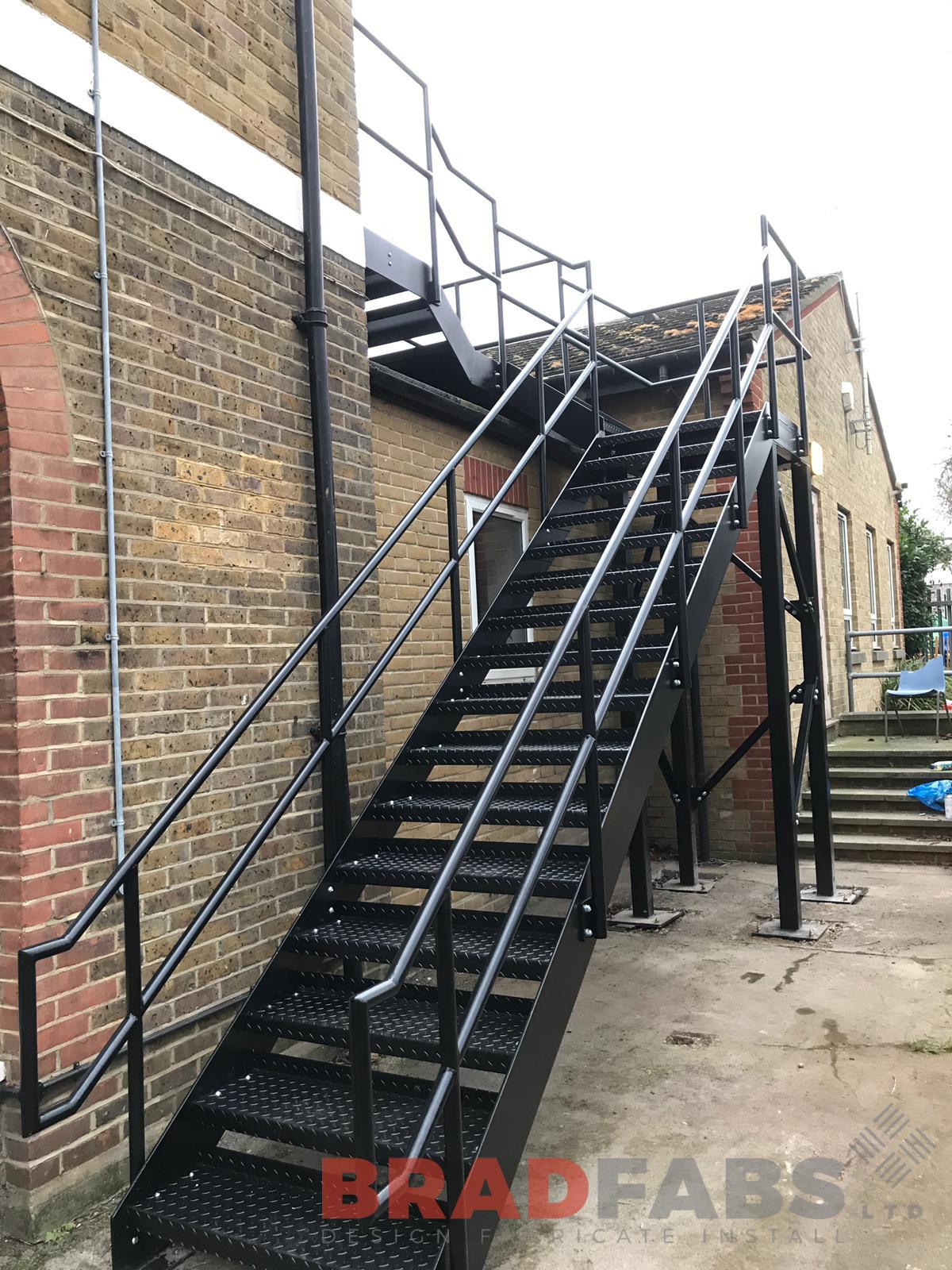 External School Fire Escape Staircase in mild steel, galvanised and powder coated with vertical bar balustrade and durbar treads manufactured and installed by School Experts Bradfabs