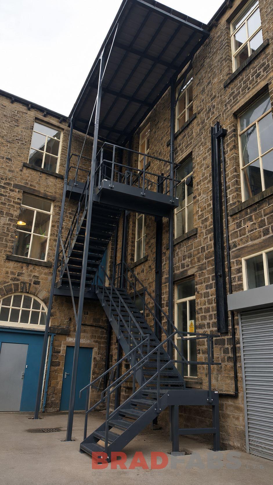 Fire escape with canopy installed in Huddersfield and designed by Bradfabs