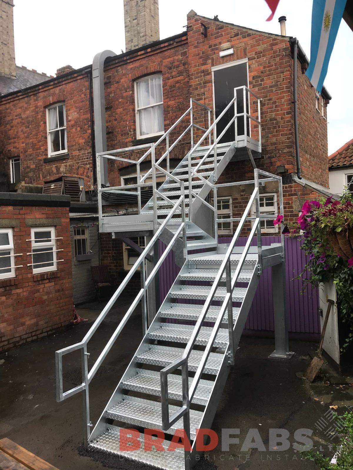Steel galvanised fire escape staircase with vertical bar balustrade