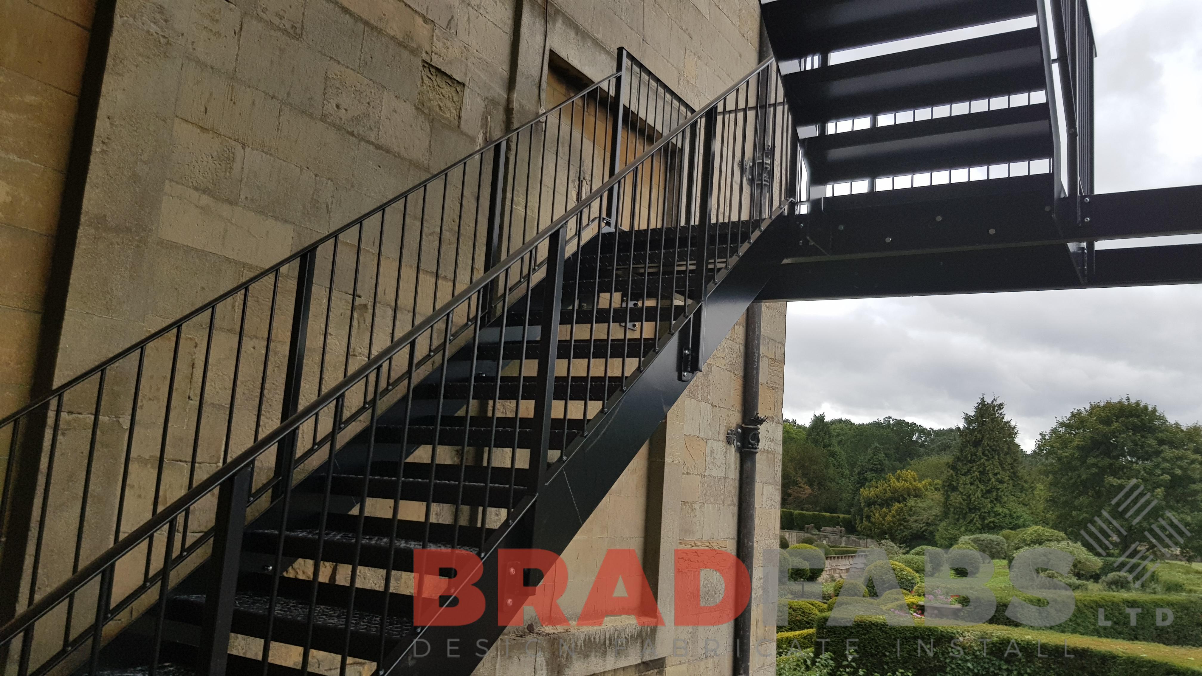 Powder coated black galvanised straight fire escape staircase mild steel on a stately home