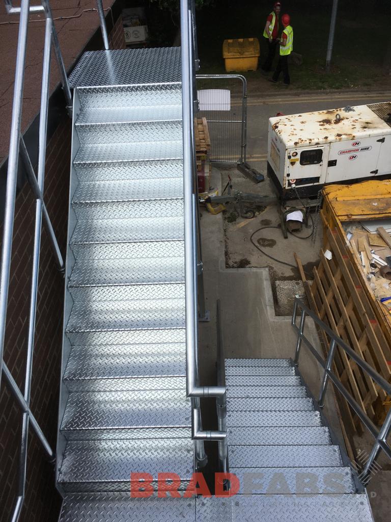 Mild steel and galvanised external staircase with top and mid rail balustrade complete with durbar treads by Bradfabs 