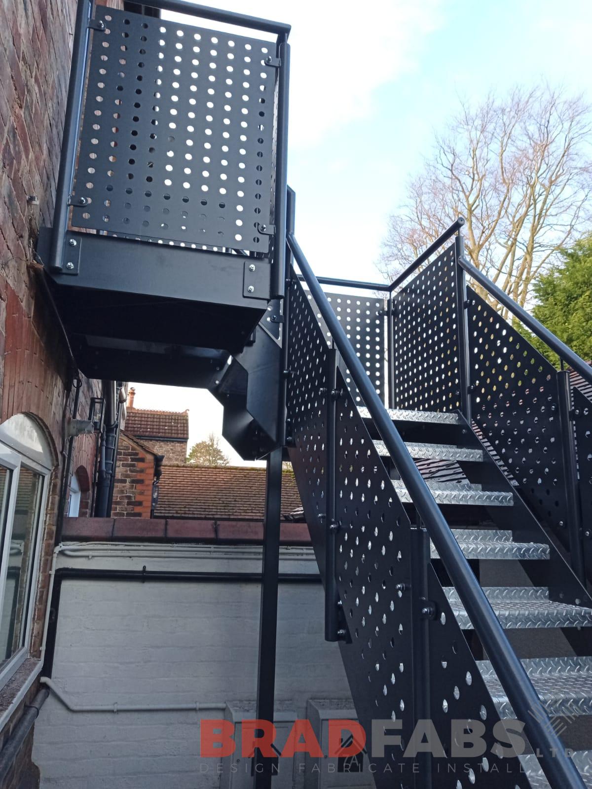 Bespoke fire escape manufactured in mild steel, galvanised and powder coated complete with durbar treads by Bradfabs