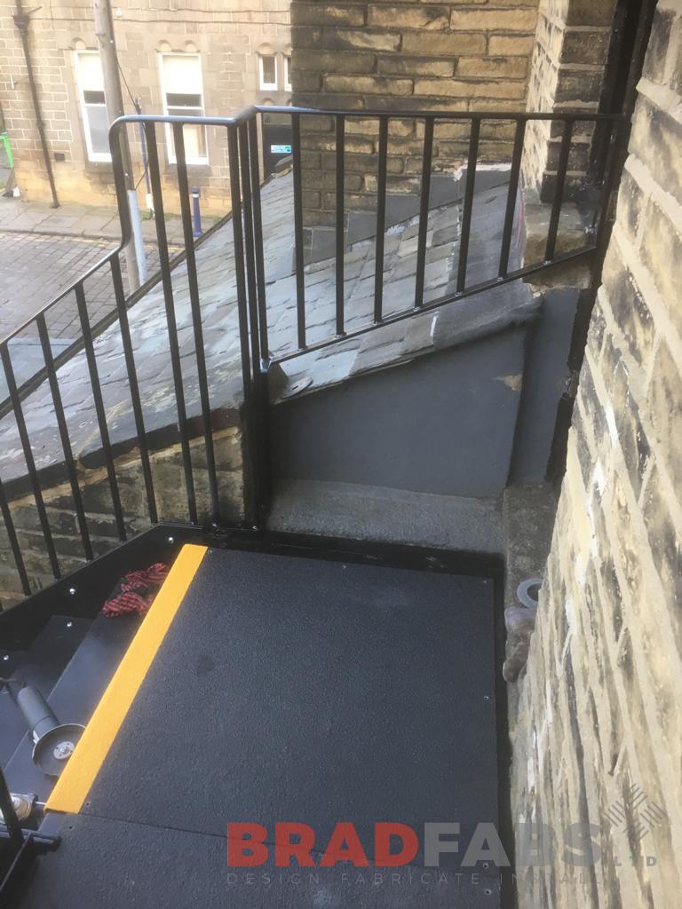 mild steel, galvanised and powder coated straight external staircase, with vertical bar balustrade on the stairs and landing, with durbar treads and yellow nosing by Bradfabs Ltd