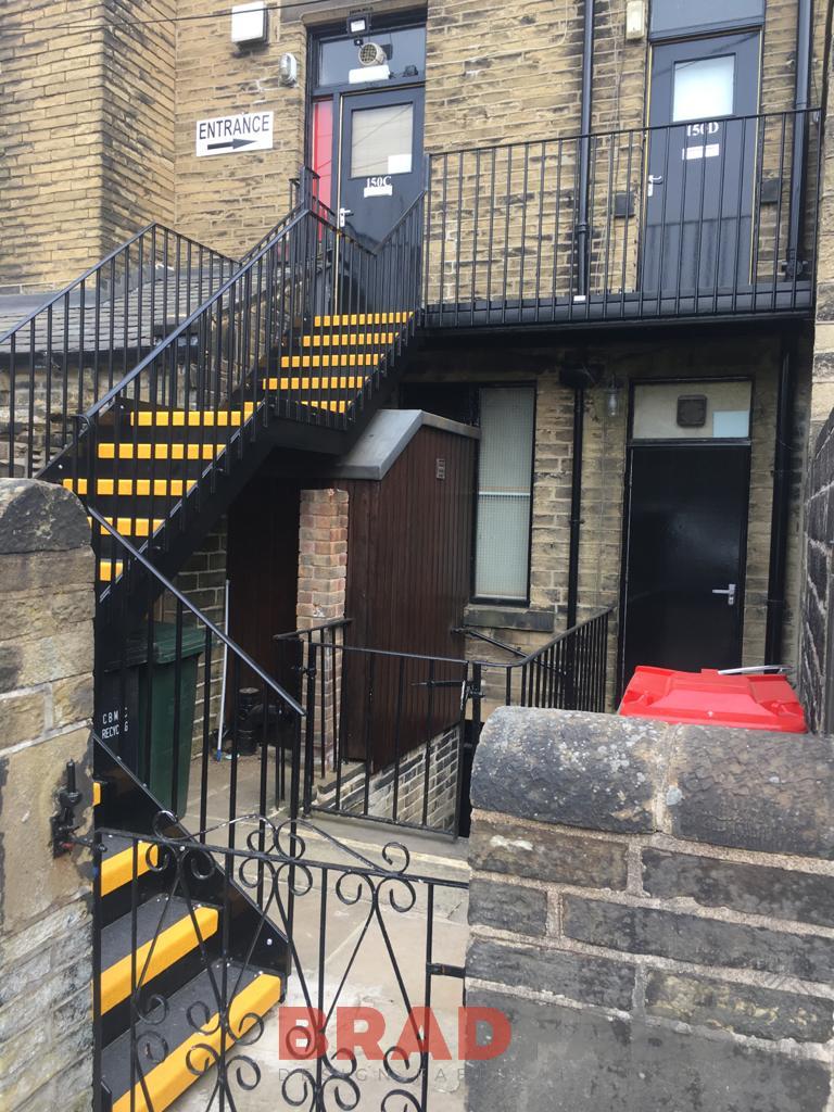 mild steel, galvanised and powder coated external staircase with yellow nosings on the GRP treads by Bradfabs Ltd 