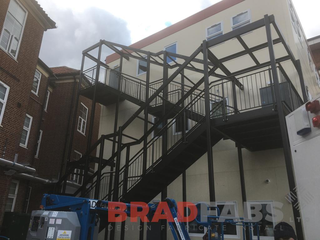 Large bespoke external staircase with top and mid landing, with vertical bar balustrade by bradfabs