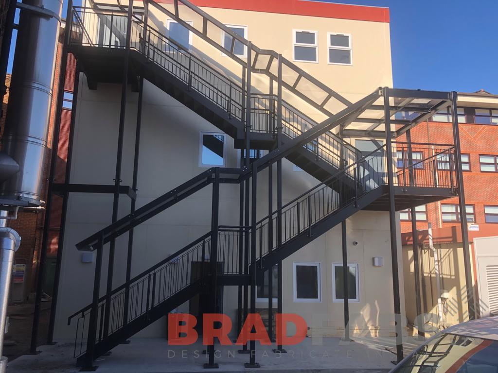 Large straight two flight  external staircase, manufactured in mild steel, galvanised and powder coated black by bradfabs