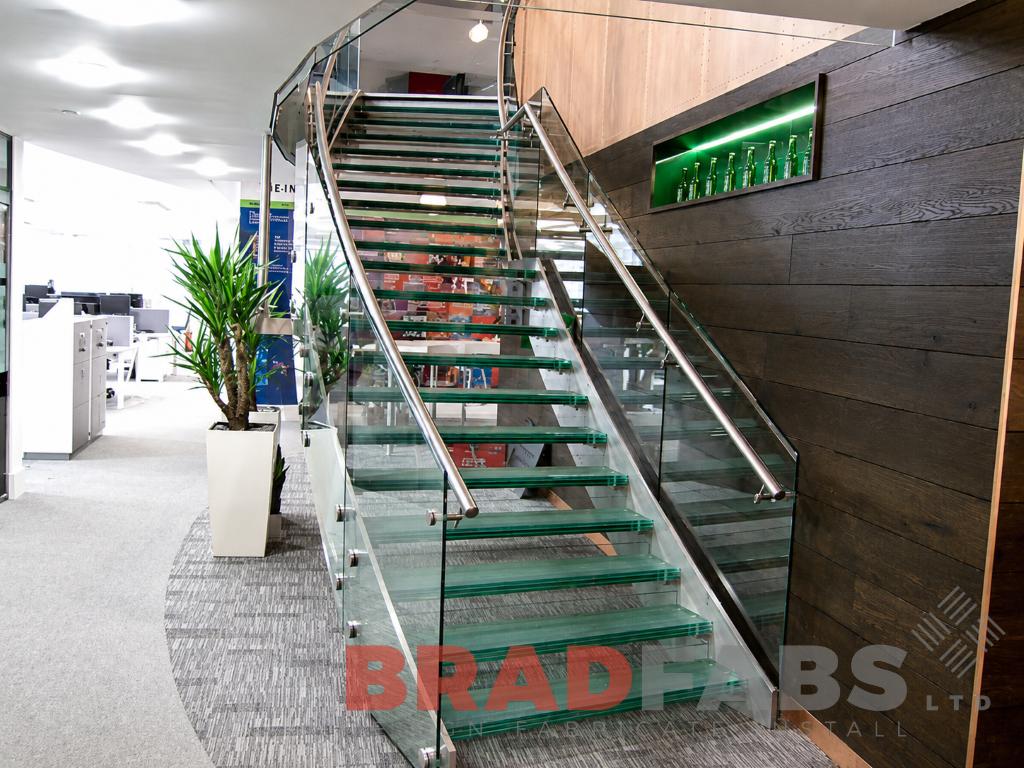 curved glass staircase stainless steel for Heineken in London