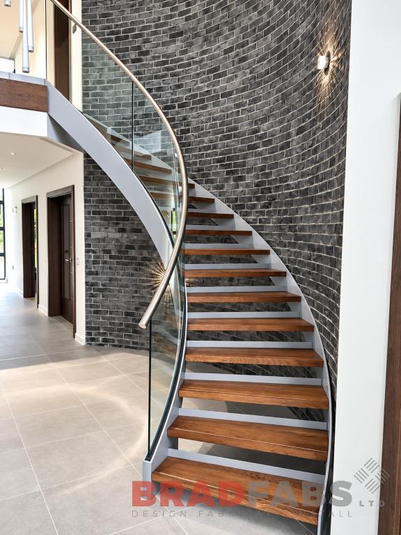 Stunning bespoke helix with curved glass in Poole