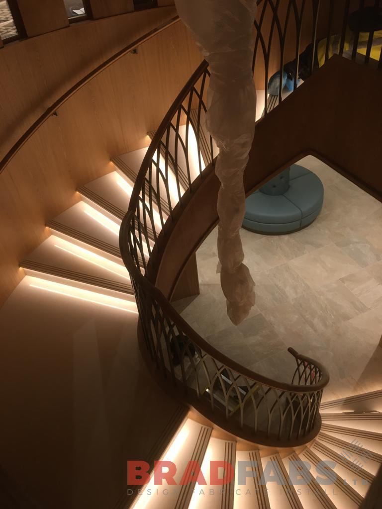 Individually designed grand helical staircase by Bradfabs, with decorative balustrade for a commercial project 