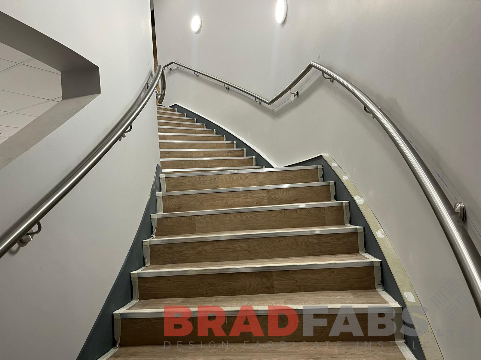 Helix staircase, bespoke curved staircase with stainless steel handrail by bradfabs