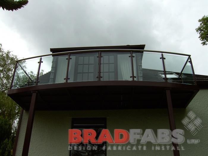 Elevated Balcony made to match existing brown windows