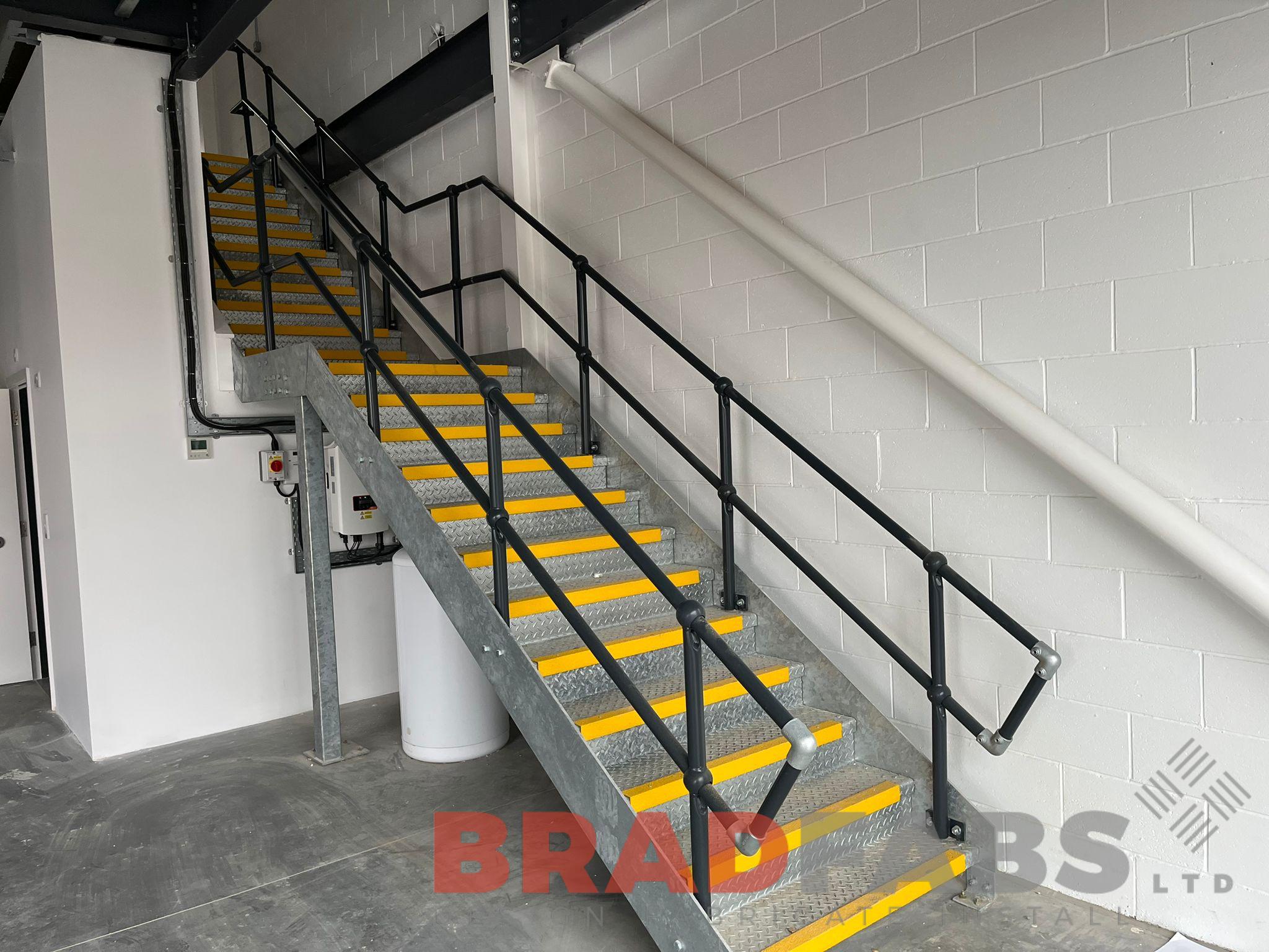 Staircase with durbar treads and yellow nosings by bradfabs 