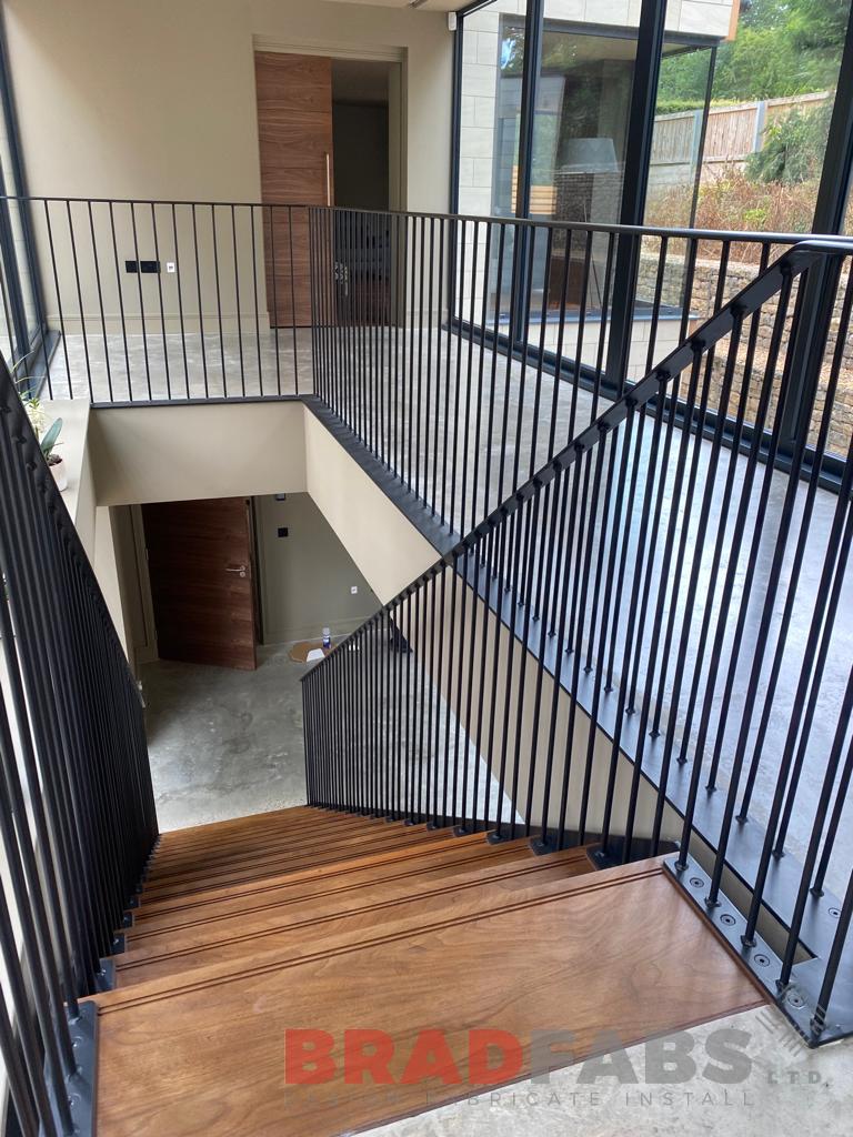 Straight internal staircase with vertical bar balustrade and oak treads by bradfabs 