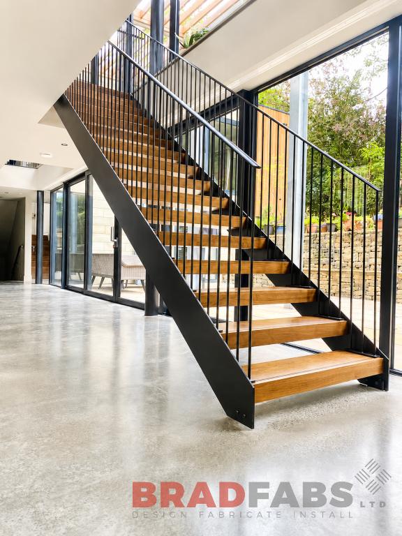 Straight internal staircase with vertical bar balustrade and oak treads by bradfabs 
