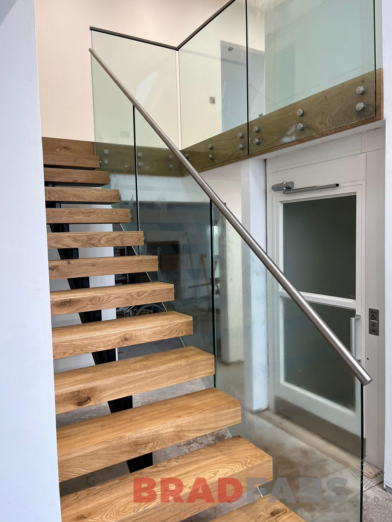 Internal staircase with oak treads and glass balustrade by bradfabs