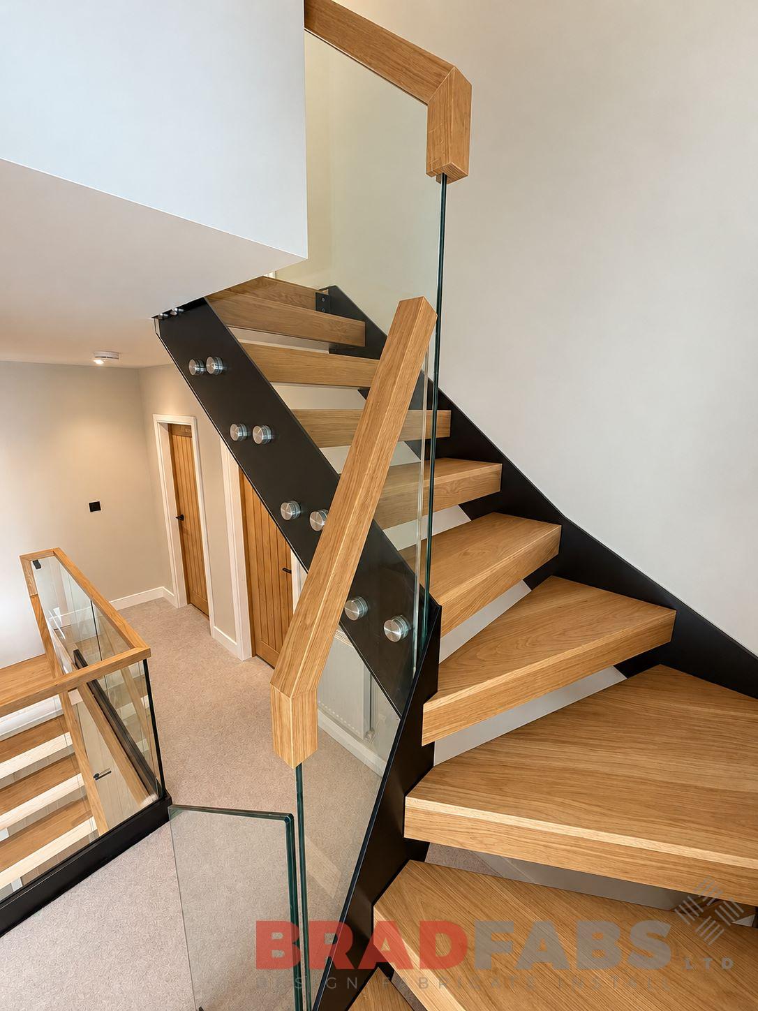 Modern oak box treads and landings with infinity glass balustrade, installed in Leicester