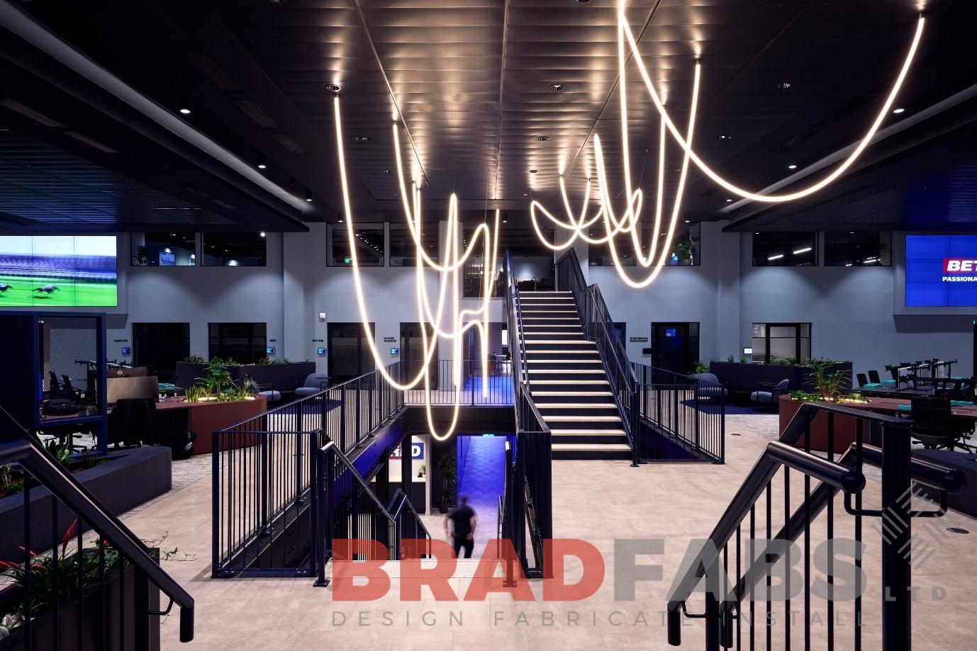 Modern large straight staircase for an office installed by Bradfabs in Warrington
